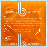 The orange package of bCondoms Studded Condoms features prominent white text and a logo. Made from natural rubber latex, these triple-tested condoms provide dependable protection, along with a cautionary note on preventing pregnancy and sexually transmitted infections.